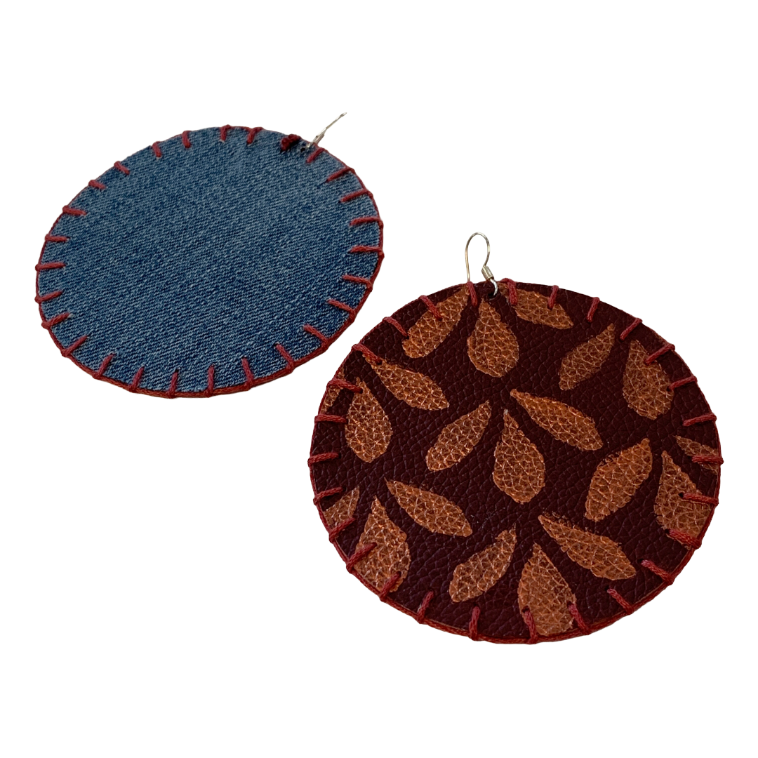 MUM'A NAI | Maxi Attraction – Amil #1 | Upcycled denim and acrylic on maroon leather with maroon cotton embroidery and sterling silver hooks | 8 (d) cm