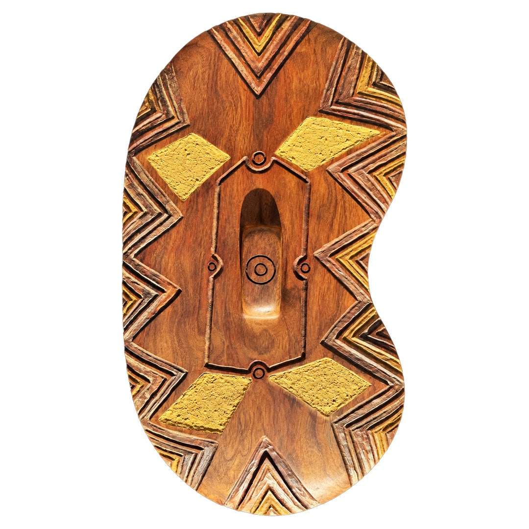 BULBURA CREATIONS | 'What Country holds' | Balan Bigin (Rainforest Shield) | 2026 | Carved blood gum (Yarrabah)/ Ochre inlay | 660 x 350 x 90 mm