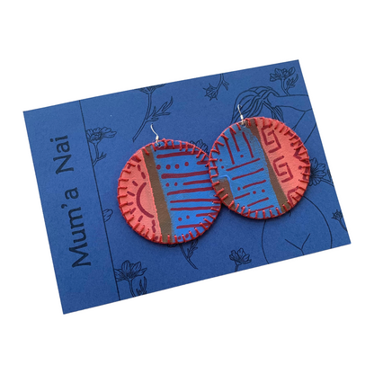 MUM’A NAI | ‘Colossal Charms – Tribal Love #1’ | Upcycled blue cotton material / acrylic on canvas / fuchsia cotton embroidery / sterling silver hooks | 7 (d) cm