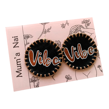 MUM’A NAI | ‘Maxi Attraction – Vibe #1’ | Upcycled mustard corduroy / acrylic on black leather / sparkle copper embroidery / sterling silver hooks | 8 (d) cm