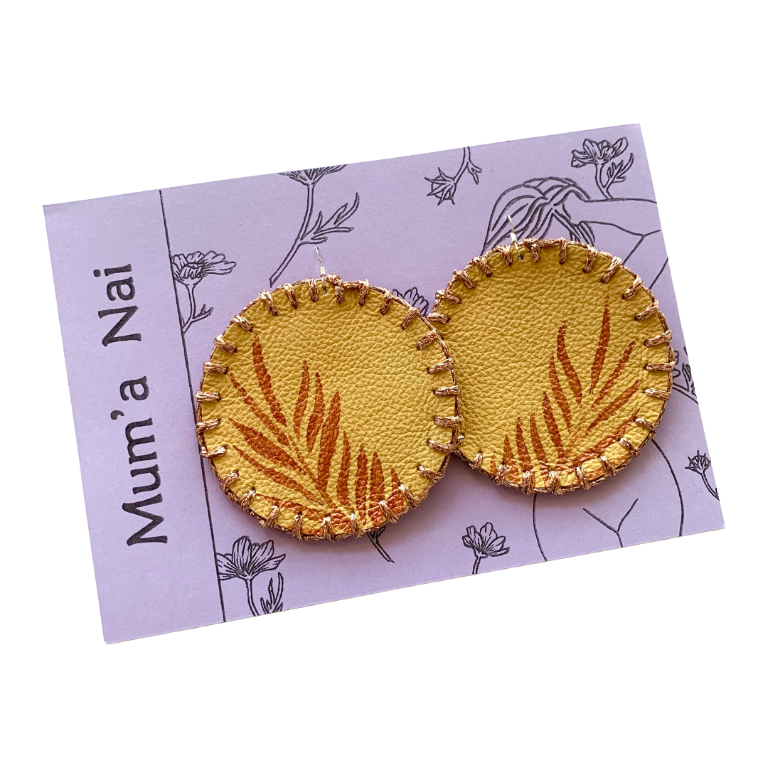 MUM’A NAI | ‘Maxi Attraction – Tropics #2 | Upcycled mustard corduroy / acrylic on yellow leather / sparkle copper embroidery / sterling silver hooks | 8 (d) cm