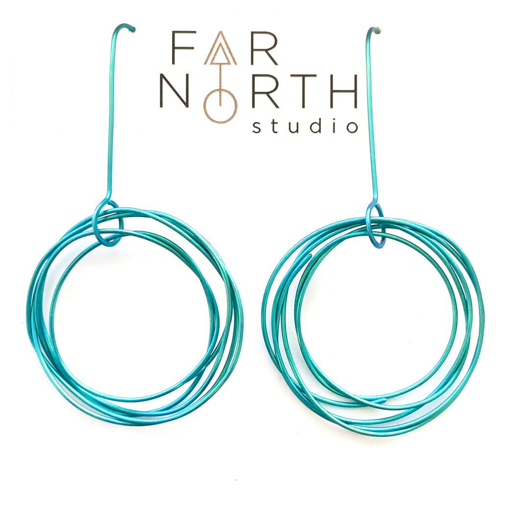FAR NORTH STUDIO | ‘Orbit earrings (large) – Teal’ | Titanium