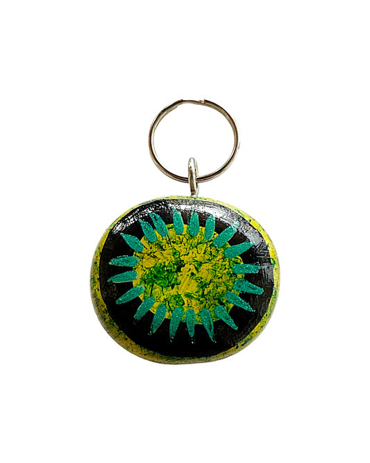 SHERYL J BURCHILL | ‘Rainforest or Sea’ | Burnie bean keyring / hand painted | Green / yellow / black / teal